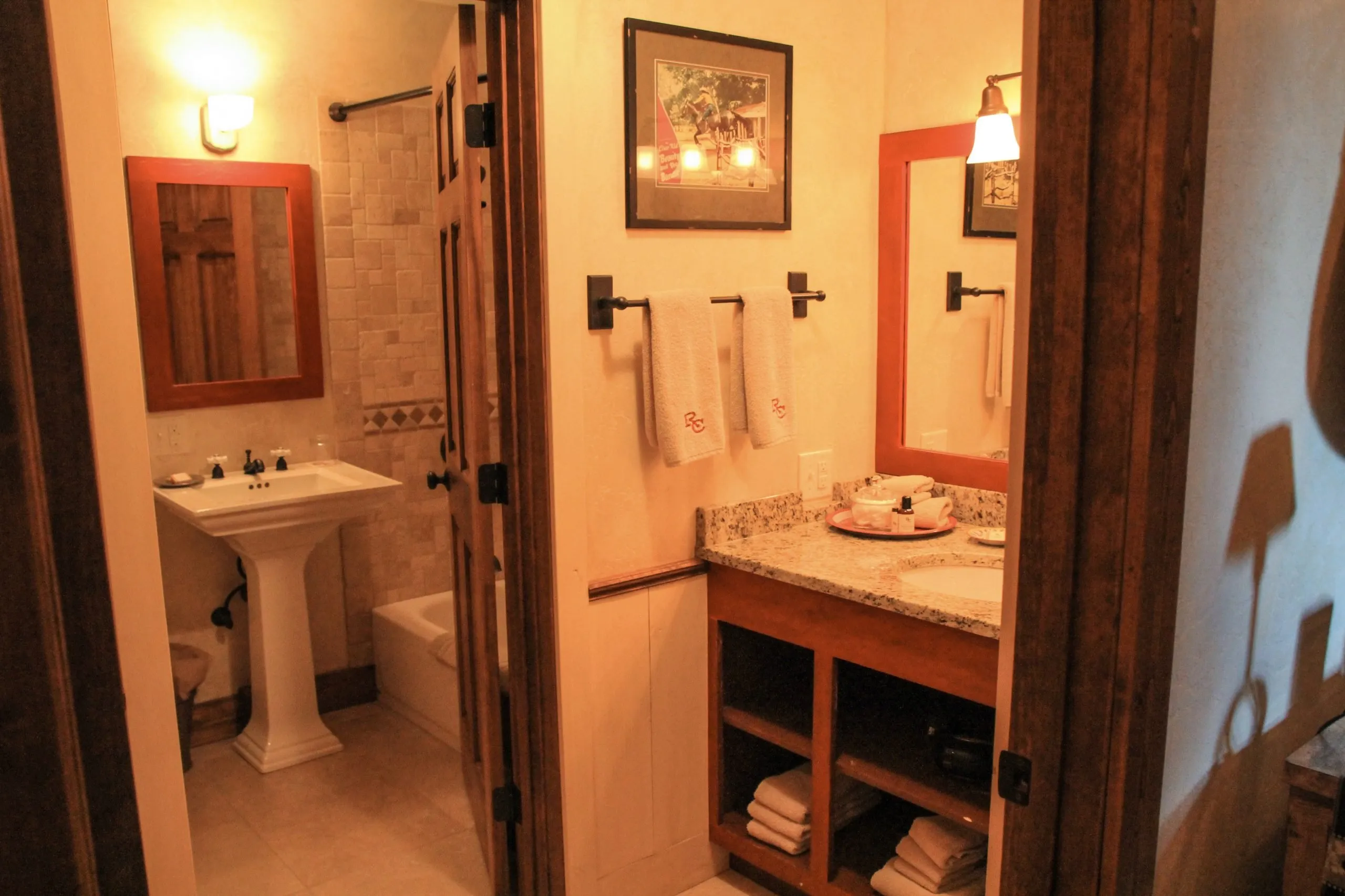 Bathroom with pedestal sink and mirror