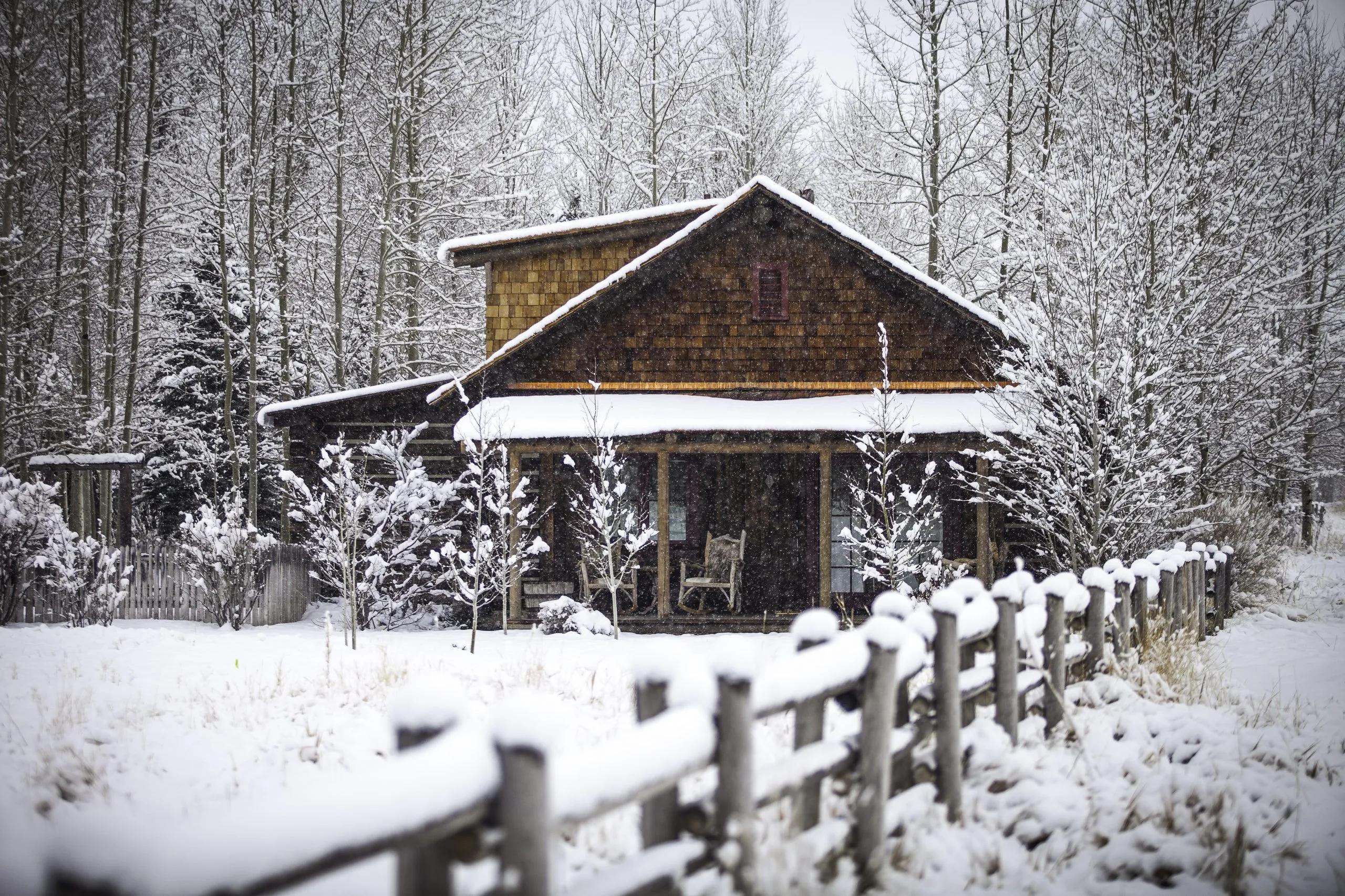 Cabin covered in snow during the winter