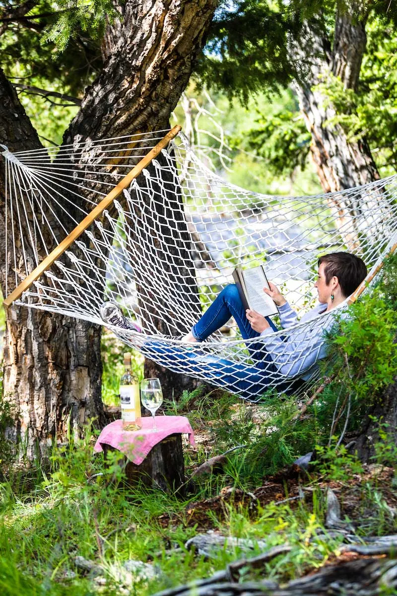 Person in hammock reading a book