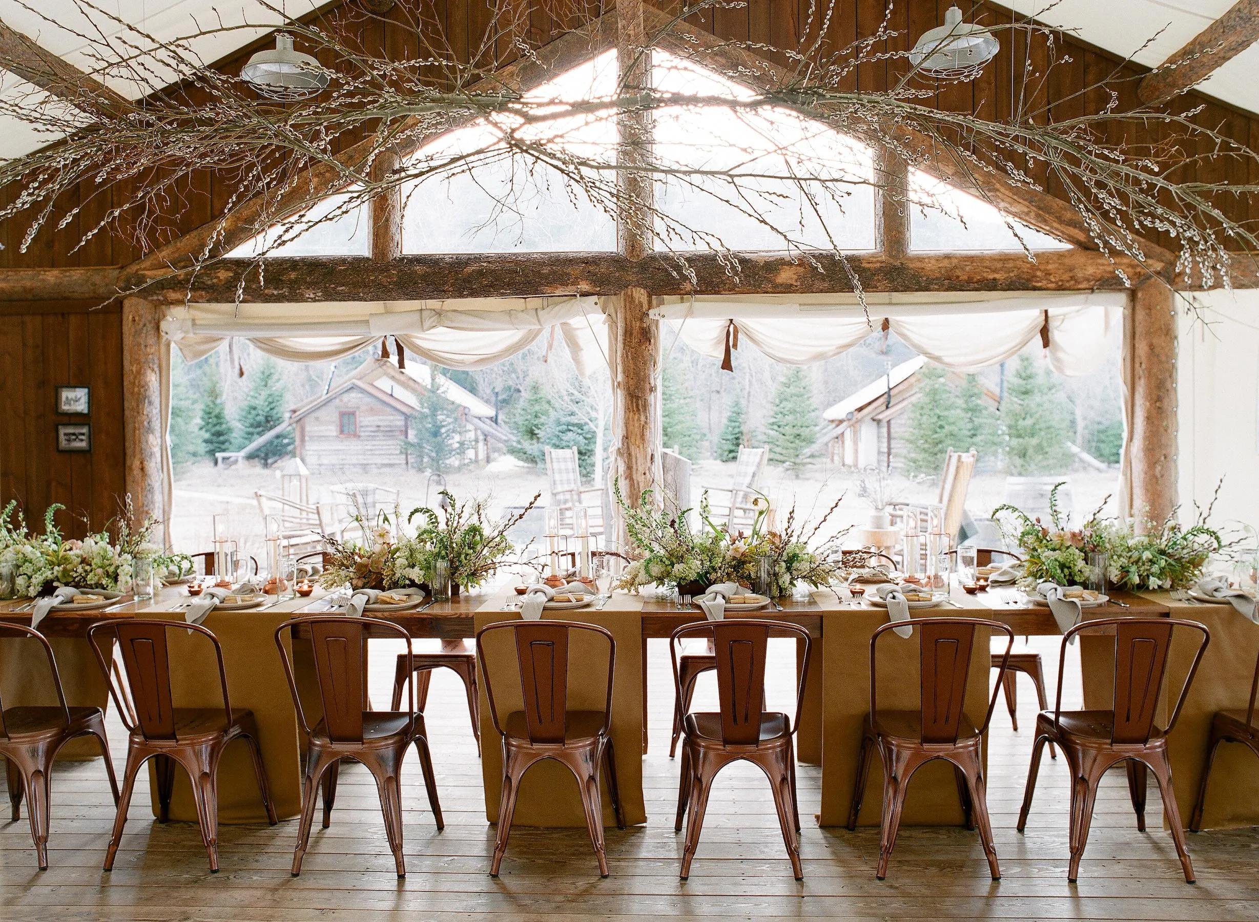 Interior wedding venue set with floral arrangements