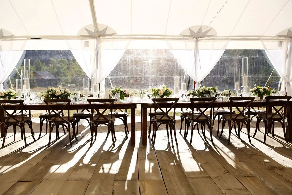 Long table set within a outdoor tent