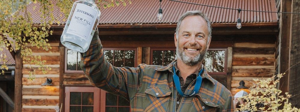 Trey Zoeller of Jefferson's Bourbon holding a new fill whiskey bottle