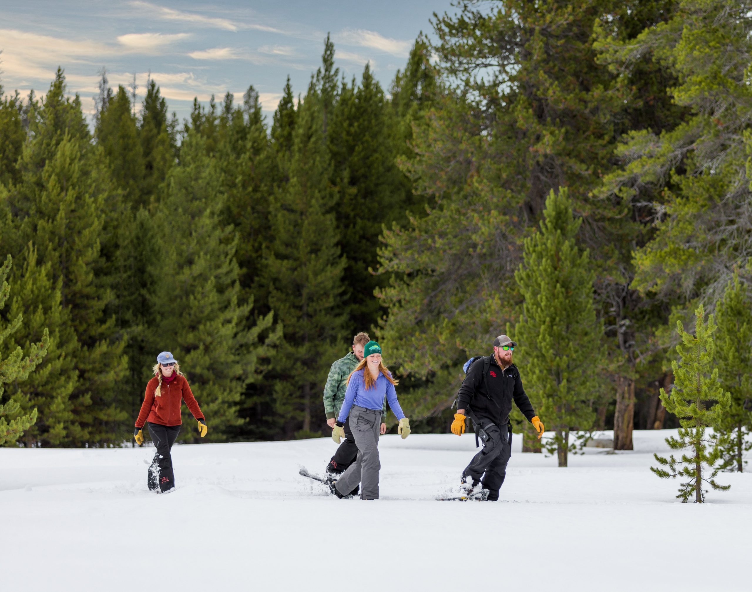 Four people snowshoeing at The Ranch at Rock Creek