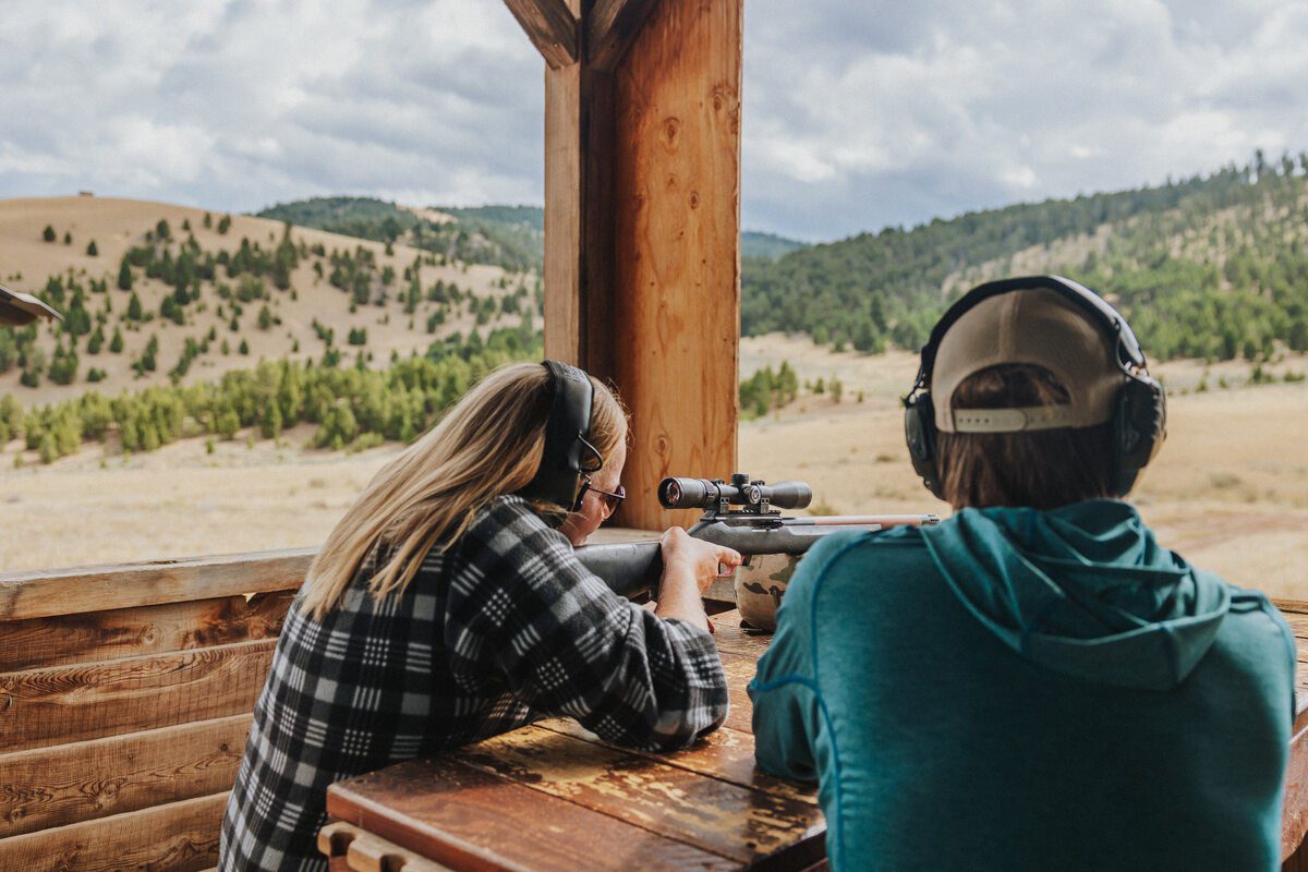 Man and Woman Shooting Rifles